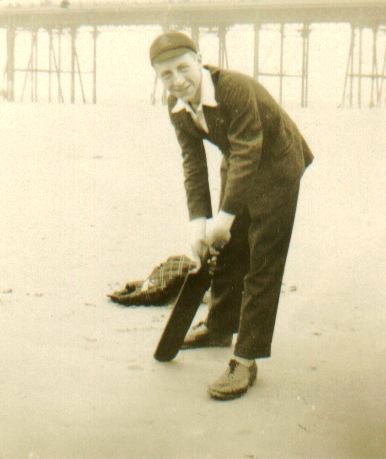 Hartley Stephenson Watts with school cap and cricket bat, 1927