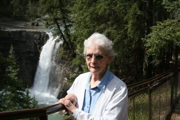 Shirley Ponceby by waterfall